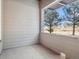 Covered porch with view of pine trees at 485 Interlocken Blvd # 102, Broomfield, CO 80021