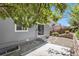 Backyard features a stone and concrete patio, a privacy fence, and mature landscaping at 1963 Hogan Ct, Castle Rock, CO 80109