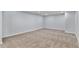Finished basement space with neutral carpet, recessed lighting, and outlets along the walls at 1963 Hogan Ct, Castle Rock, CO 80109