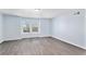 Spacious, well-lit bedroom with large windows and modern gray flooring at 1963 Hogan Ct, Castle Rock, CO 80109