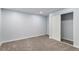 Cozy bedroom featuring neutral carpeting and a closet with a sliding door for optimal storage at 1963 Hogan Ct, Castle Rock, CO 80109