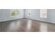 Bright bedroom features hard floors, neutral paint, and multiple windows at 1963 Hogan Ct, Castle Rock, CO 80109