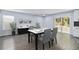 Bright dining area featuring modern furnishings, stylish decor, and sliding glass doors to the backyard at 1963 Hogan Ct, Castle Rock, CO 80109