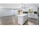 Open concept kitchen featuring a central island, stainless appliances and adjacent dining area at 1963 Hogan Ct, Castle Rock, CO 80109