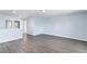 Spacious living room area with sleek gray floors and bright light at 1963 Hogan Ct, Castle Rock, CO 80109