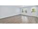 Bright living room area that features modern hard flooring, neutral paint, and a front door at 1963 Hogan Ct, Castle Rock, CO 80109