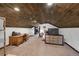 Spacious bedroom with wood ceilings and built-in workspace at 260 4Th Ave, Hudson, CO 80642