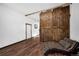 Bonus room with barn door and hardwood floors at 260 4Th Ave, Hudson, CO 80642