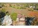 Scenic aerial view of a home with a brown roof in a suburban neighborhood next to an open field at 9535 W 104Th Ct, Broomfield, CO 80021