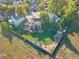 Aerial view of a home's backyard, highlighting green lawn, mature trees, storage shed, and a privacy fence at 9535 W 104Th Ct, Broomfield, CO 80021