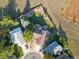 Aerial shot of backyard, showcasing a green yard, a brick patio, a mature tree, and privacy fence at 9535 W 104Th Ct, Broomfield, CO 80021