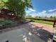 Expansive backyard showcasing a tiered patio, lush lawn, wooden pergola, and mature landscaping, perfect for outdoor enjoyment at 9535 W 104Th Ct, Broomfield, CO 80021