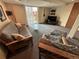 Finished basement features a sitting area, glass table, and plenty of natural light at 9535 W 104Th Ct, Broomfield, CO 80021