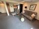 Finished basement with a cozy seating area, bar, and comfortable carpeting at 9535 W 104Th Ct, Broomfield, CO 80021
