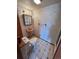 Small bathroom with a pedestal sink, toilet, and tiled floors at 9535 W 104Th Ct, Broomfield, CO 80021