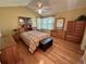 Bright bedroom features a comfortable bed, matching furniture set, and a vaulted ceiling with fan at 9535 W 104Th Ct, Broomfield, CO 80021