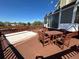 Deck area with outdoor furniture, including a table, chairs, and covered hot tub at 9535 W 104Th Ct, Broomfield, CO 80021