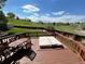 Deck area with outdoor furniture, including a table, chairs, and covered hot tub at 9535 W 104Th Ct, Broomfield, CO 80021