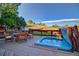 Deck area with outdoor furniture, including a table, chairs, and uncovered hot tub at 9535 W 104Th Ct, Broomfield, CO 80021