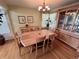 Classic dining room with hardwood flooring, and a lovely light-wood dining table with chairs for Gathering gatherings at 9535 W 104Th Ct, Broomfield, CO 80021