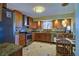 Updated kitchen featuring stainless steel appliances, tile flooring, and light wood cabinets at 9535 W 104Th Ct, Broomfield, CO 80021