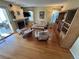 Bright living room featuring a fireplace and hardwood flooring at 9535 W 104Th Ct, Broomfield, CO 80021