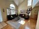 Inviting living room features hardwood flooring, high ceilings, a painting, and black sofas for Gathering gatherings at 9535 W 104Th Ct, Broomfield, CO 80021