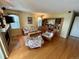 Cozy living room with a fireplace and hardwood flooring at 9535 W 104Th Ct, Broomfield, CO 80021