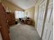 Comfortable office features a built-in desk with cabinets and closet with plenty of storage space at 9535 W 104Th Ct, Broomfield, CO 80021
