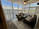 Bright sunroom with tile flooring and a view of the outdoors at 9535 W 104Th Ct, Broomfield, CO 80021