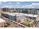 Vibrant aerial view featuring a commercial building with colorful murals, an inviting outdoor recreation area, and street traffic at 3225 Blake St # 6, Denver, CO 80205