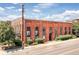 Exterior view of a red brick loft building featuring modern style and industrial-chic design at 3225 Blake St # 6, Denver, CO 80205