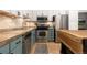 Bright kitchen featuring stone countertops, modern appliances, and sleek cabinetry at 3225 Blake St # 6, Denver, CO 80205