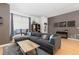 Living room with hardwood flooring, ample seating, and great natural lighting at 3225 Blake St # 6, Denver, CO 80205