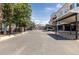Wide shot of the community parking area on a sunny day at 3225 Blake St # 6, Denver, CO 80205