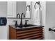 Bathroom featuring a modern vanity with sleek fixtures and a stylish mirror at 5667 S Lowell Blvd, Littleton, CO 80123
