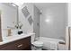 Modern bathroom featuring sleek vanity, stylish fixtures, and a shower with subway tile at 5667 S Lowell Blvd, Littleton, CO 80123