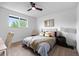 Bright bedroom with a large window and contemporary decor with a ceiling fan at 5667 S Lowell Blvd, Littleton, CO 80123