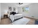 Cozy bedroom with ceiling fan and large window and stylish decor at 5667 S Lowell Blvd, Littleton, CO 80123