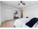 Bedroom offering ample closet space with an adjacent doorway and comfortable furnishings at 5667 S Lowell Blvd, Littleton, CO 80123