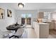 Dining area featuring a modern table, stylish chairs, and sliding glass doors to the outdoor area at 5667 S Lowell Blvd, Littleton, CO 80123
