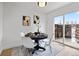 Dining area featuring a modern table, stylish chairs, and sliding glass doors to the outdoor area at 5667 S Lowell Blvd, Littleton, CO 80123