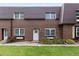 Charming townhome featuring brick facade, well-manicured lawn, and inviting front entrance at 5667 S Lowell Blvd, Littleton, CO 80123