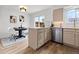 Kitchen with breakfast bar seating, stainless steel appliances, and an adjacent dining area at 5667 S Lowell Blvd, Littleton, CO 80123