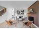 Bright living room featuring modern furnishings, striking artwork, and a cozy fireplace, perfect for relaxing and entertaining at 5667 S Lowell Blvd, Littleton, CO 80123