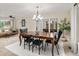 Spacious dining room with stylish lighting, ample seating, and a sophisticated atmosphere for entertaining at 5506 Irish Pat Murphy Dr, Parker, CO 80134