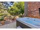 Backyard oasis featuring a relaxing hot tub and tranquil outdoor seating area at 5506 Irish Pat Murphy Dr, Parker, CO 80134