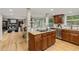 Modern kitchen boasts stone accents, granite countertops, stainless steel appliances, and seamless integration with living spaces at 5506 Irish Pat Murphy Dr, Parker, CO 80134