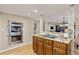 Well-equipped kitchen with stainless steel built-in oven and cooktop, granite countertops, and open layout at 5506 Irish Pat Murphy Dr, Parker, CO 80134