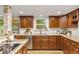 Well-lit kitchen featuring updated cabinetry, granite countertops, stainless steel appliances, and a bright, airy feel at 5506 Irish Pat Murphy Dr, Parker, CO 80134